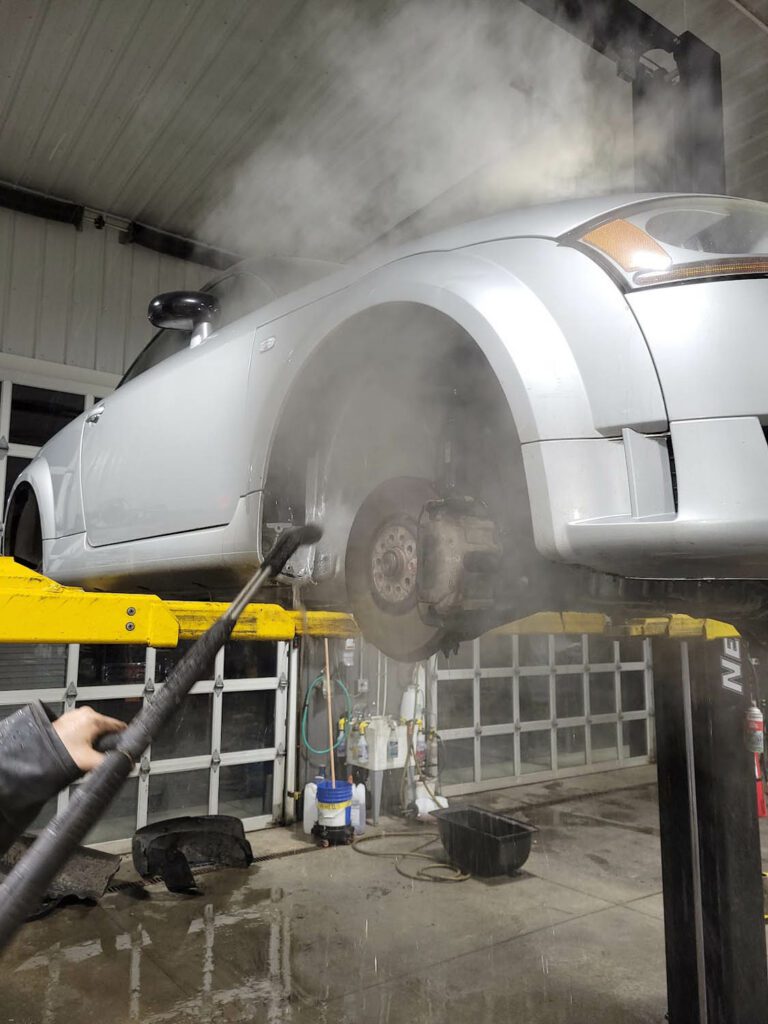 Next Gen Car Care service team performing routine auto care and maintenance at their shop in Clinton NY.