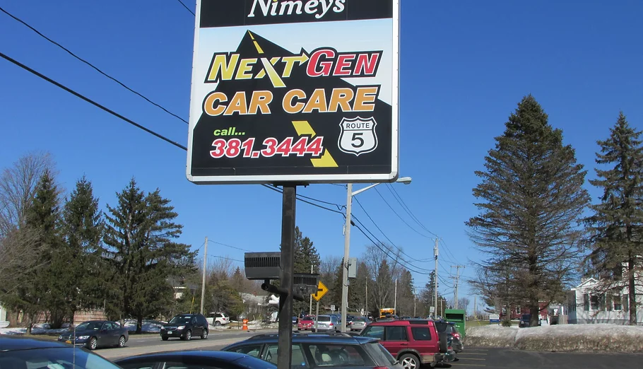 NextGen Car Care sign photographed in Clinton, NY.