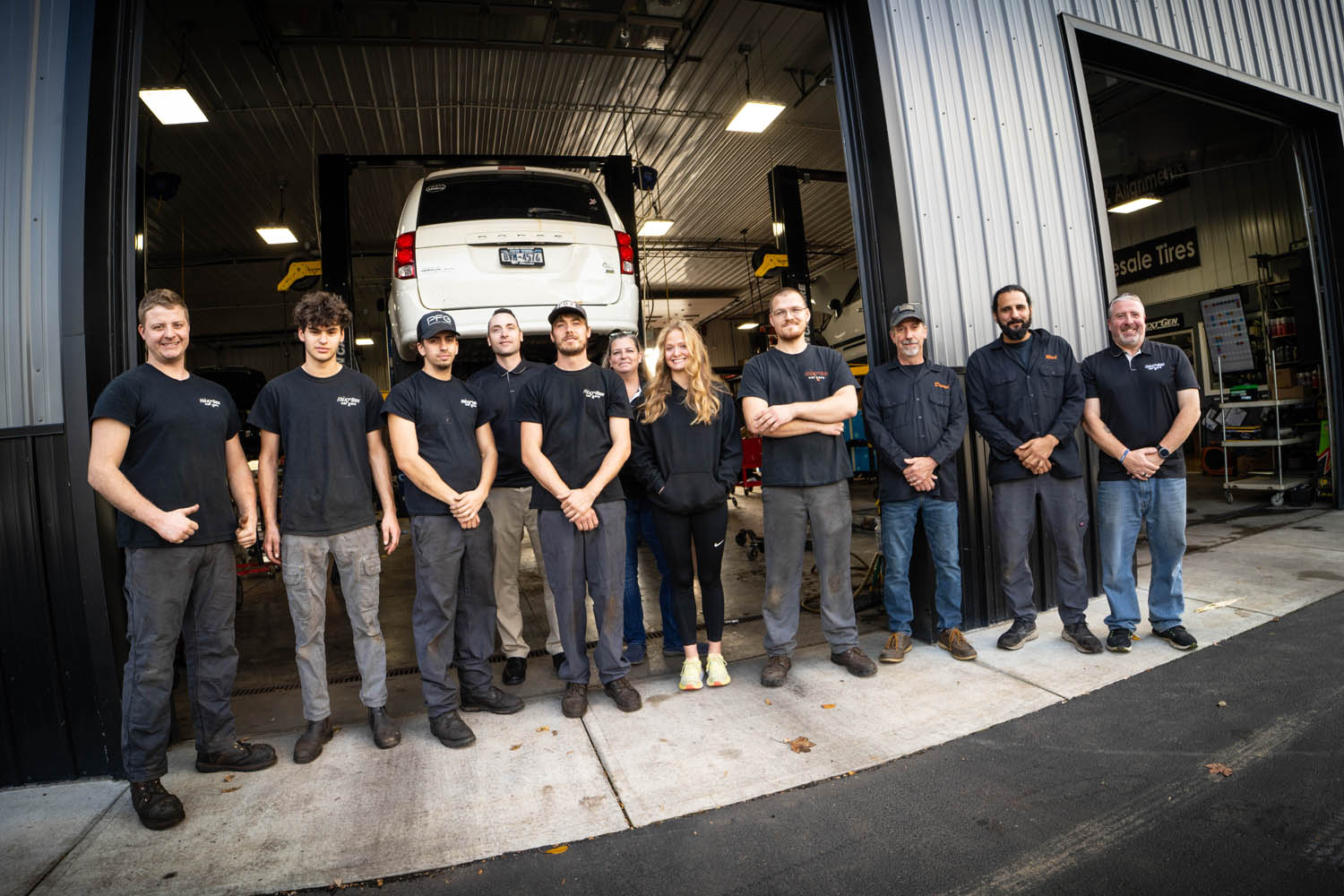Next Gen Service team photographed in front of their shop in Clinton NY.