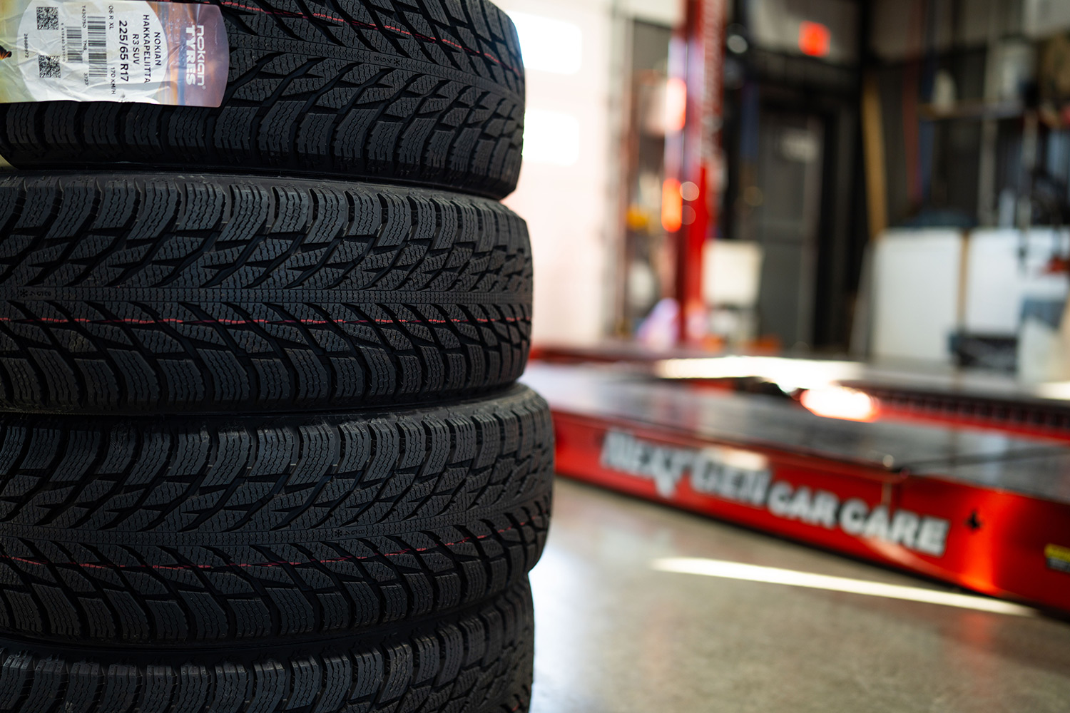 Stack of tires in Next Gen Car Care shop located in Clinton, NY.