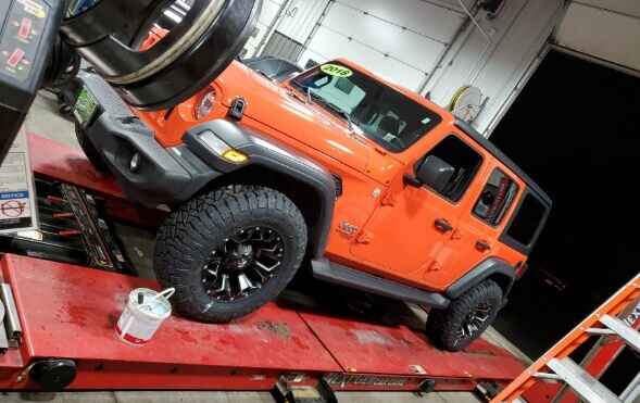 Jeep Wrangler at the Next Gen Car Care shop in Clinton, NY for routine maintenance.