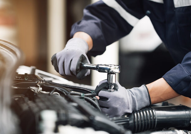 Mechanic working on a car engine